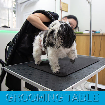 Small 16 × 24 inch anthracite grooming mat on a professional grooming table
