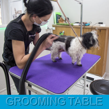 Large 24 × 36 inch purple grooming mat covering a professional grooming table