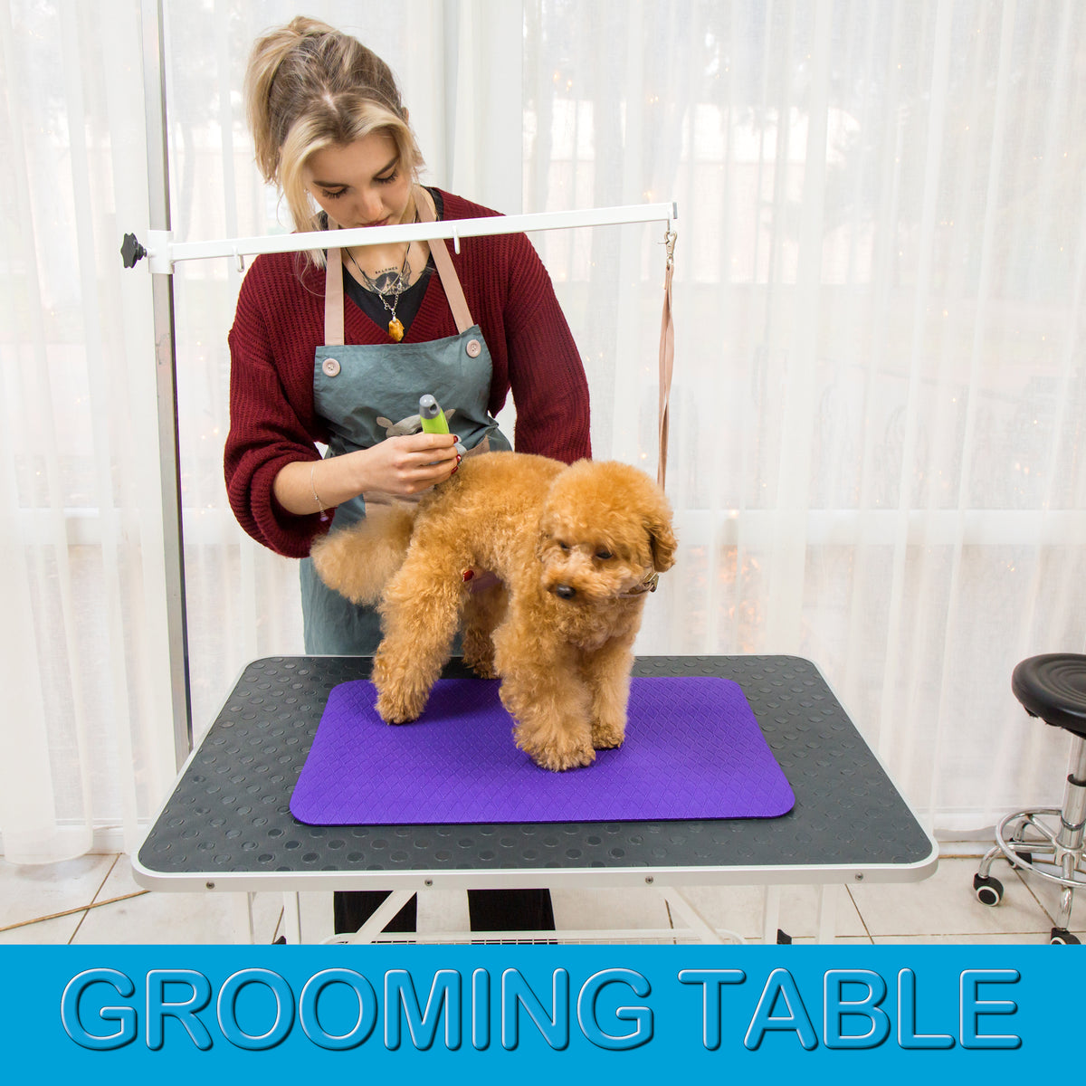 Small 16 × 24 inch purple grooming mat on a professional grooming table