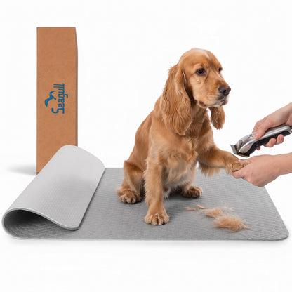 Light grey non-slip dog grooming table mat with dog and grooming clippers