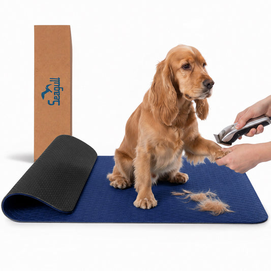 Dark blue non-slip dog grooming table mat with dog and grooming clippers