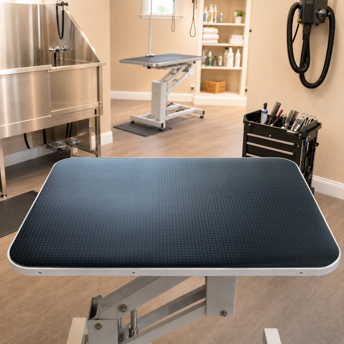 Black professional dog grooming table mat 24x36 in fitted on a grooming table in a professional salon