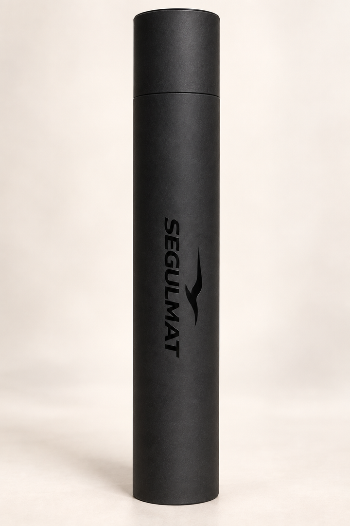 Black cylindrical tube packaging for SEGULMAT Professional PVC dog grooming table mat